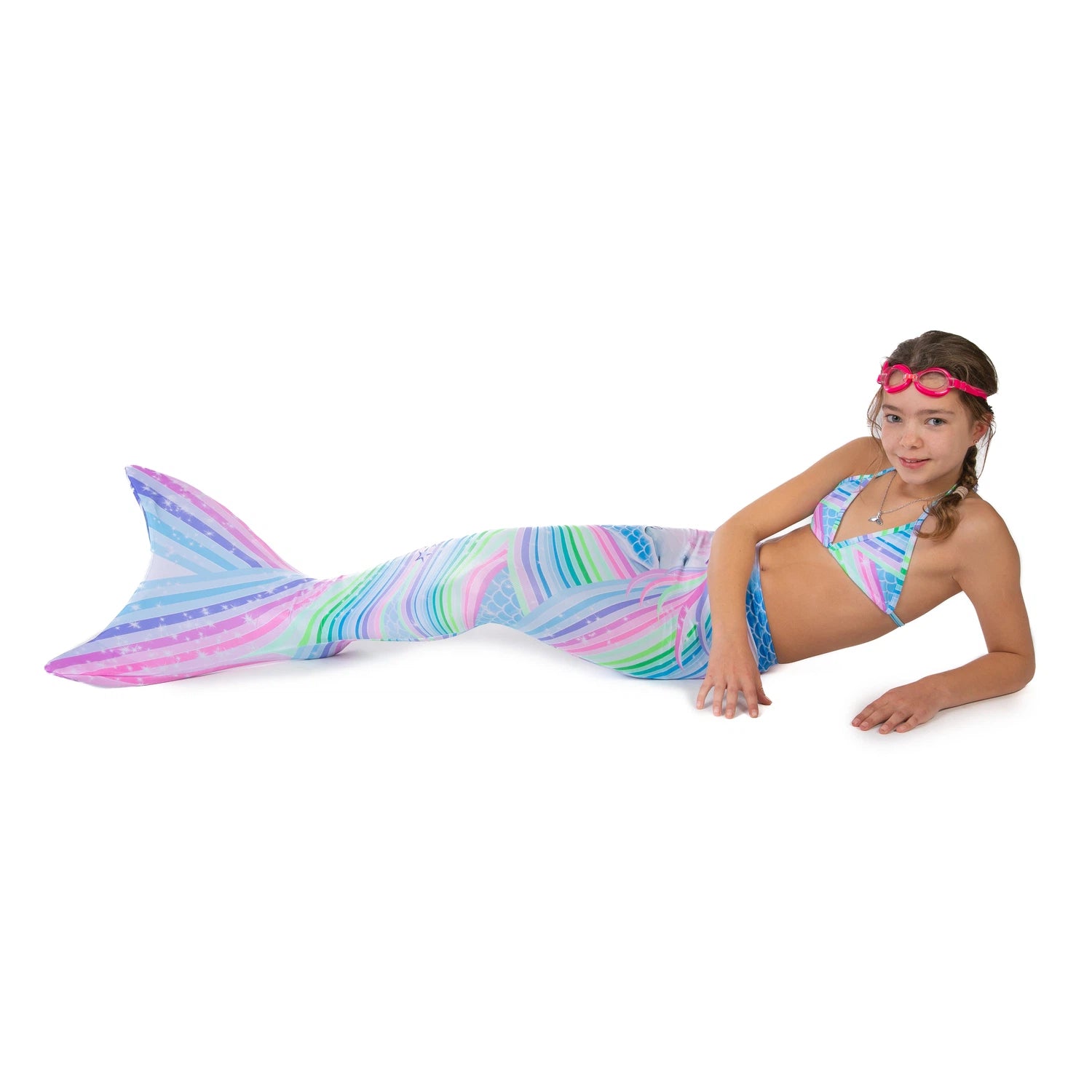 Girl with Ocean Queens Unicorn mermaid tail set on. Pink swimming goggles on head| studio photography