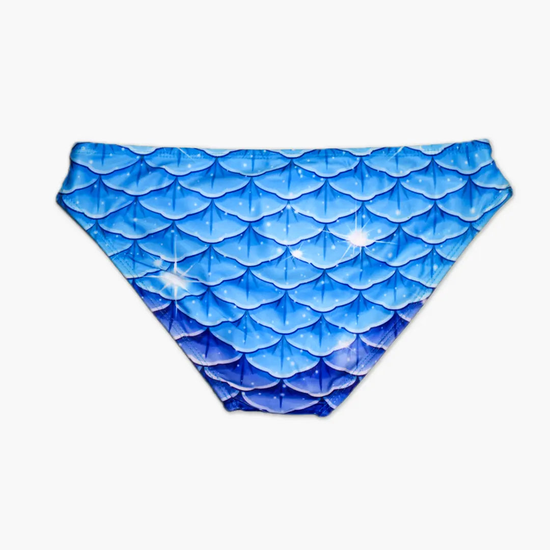 Back view Studio product photography of Bikini bottom featuring a blue fish scales print, part of the Ocean Queens Galaxy Swim Brief collection