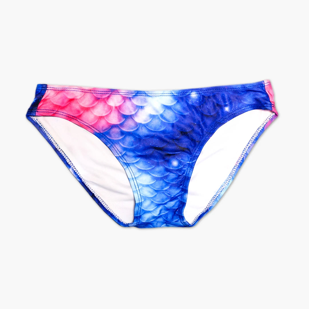 Front view Studio product photography of Bikini bottom featuring a blue and pink galaxy fish scales print, part of the Ocean Queens Lunar Swim Brief collection
