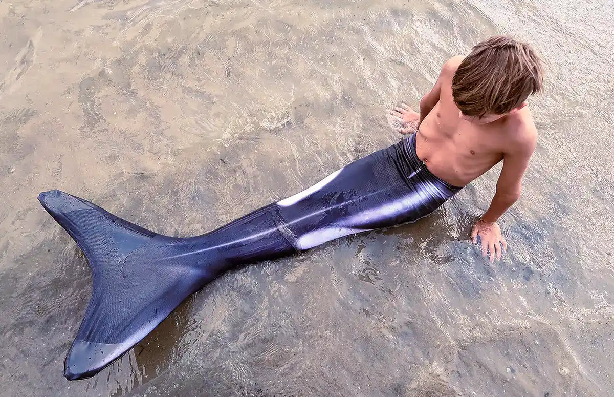 Boy in Orca Mermaid Tail Ocean Queens in the Dutch Sea - real life photography