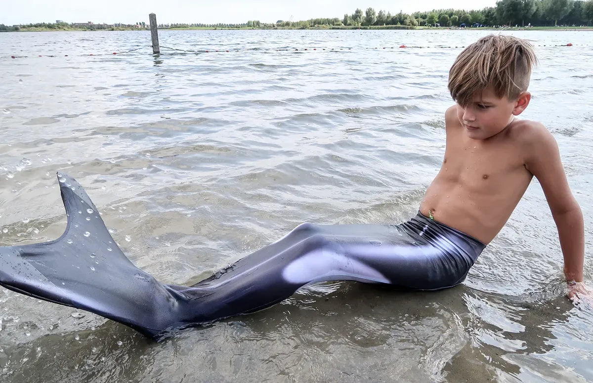 Boy at lake with Ocean Queens Orca Mermaid Tail